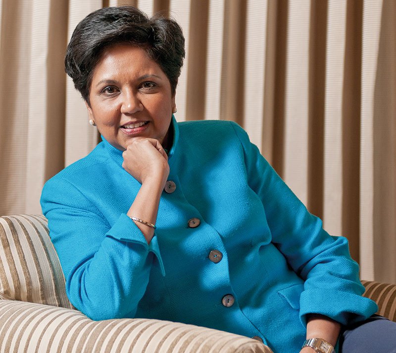 Indra Nooyi sitting on a couch