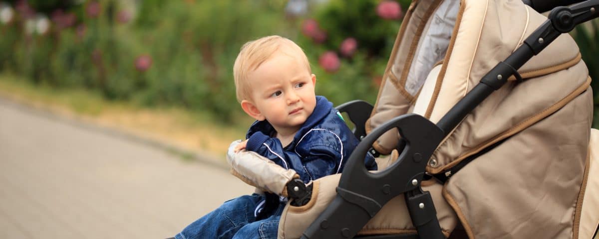 Toddler in baby carriage
