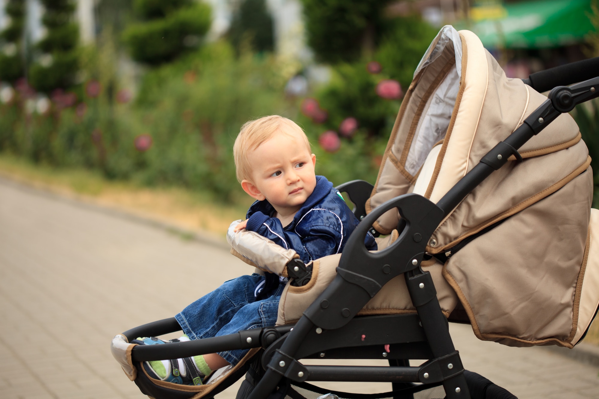 Toddler in baby carriage